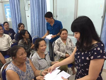 Assisting for people who are the victims of the fire accident in Rice Market - Cau Ong Lanh ward - District 1, Ho Chi Minh City